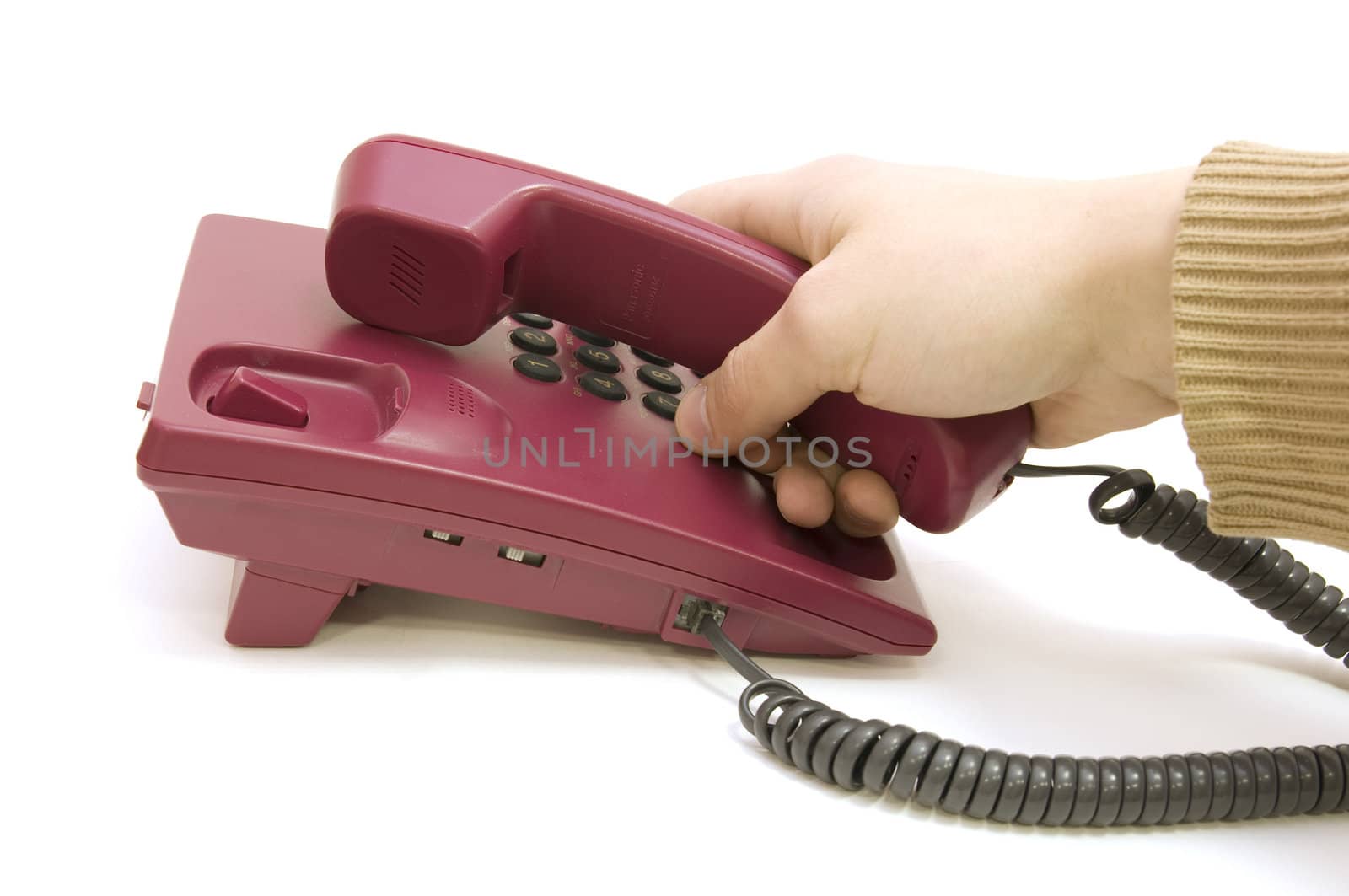 Male hand pick up the telephone on white background by zoommer