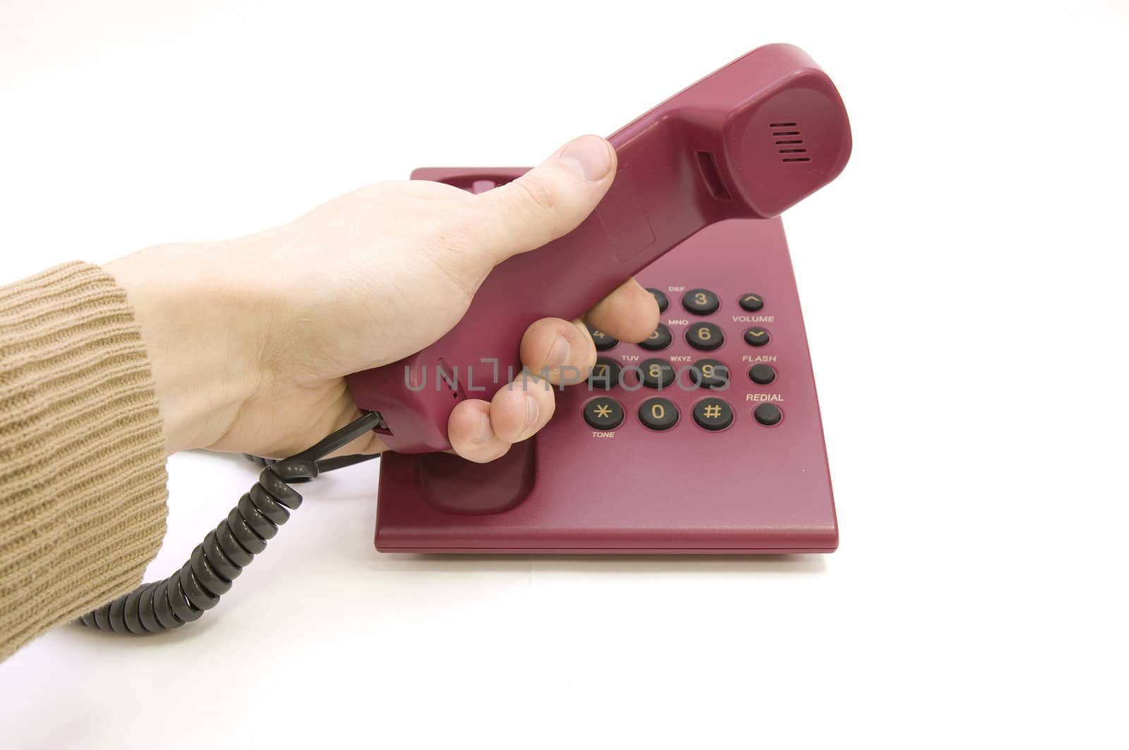 Male hand pick up the telephone on white background by zoommer