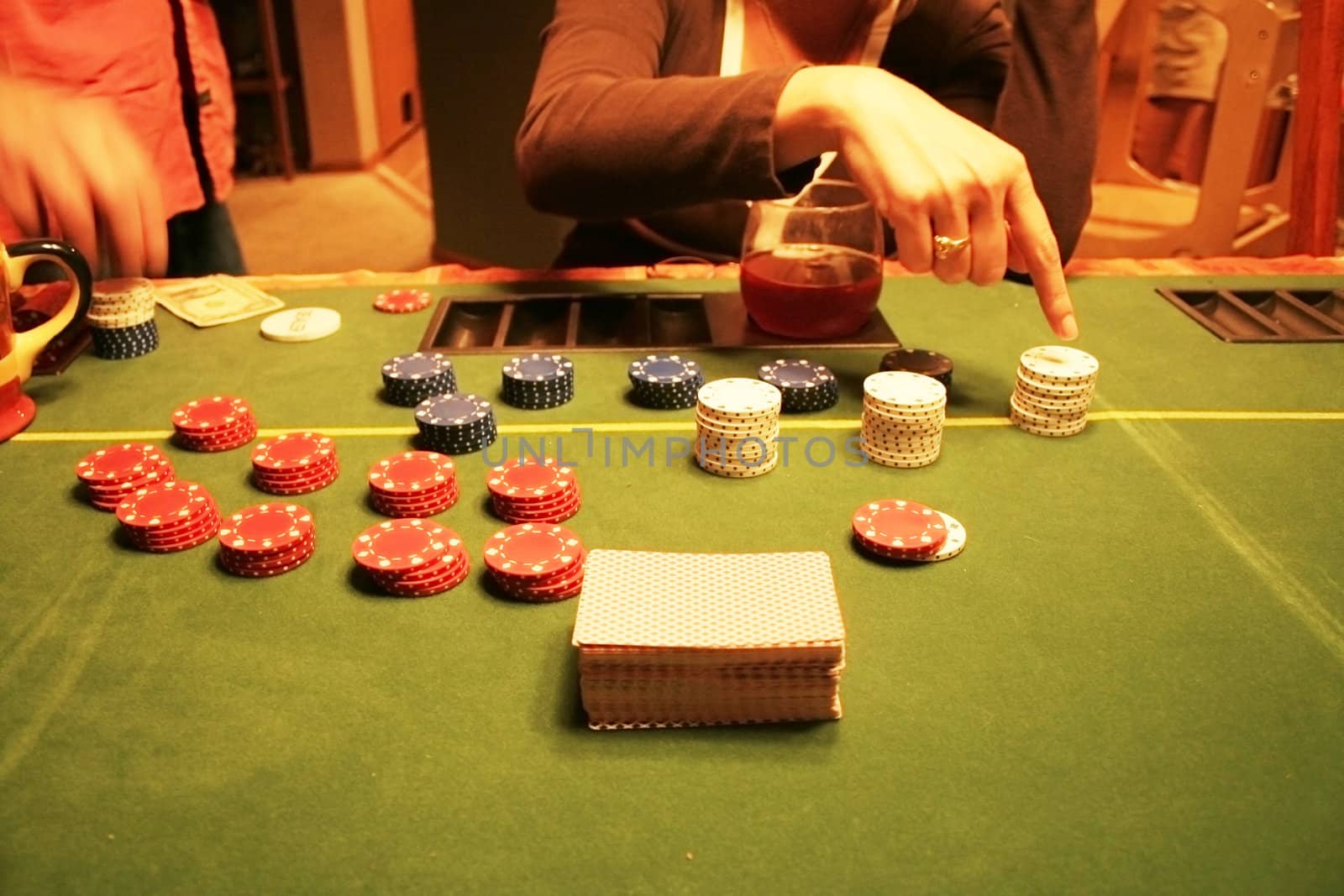 Poker table with chips being counted