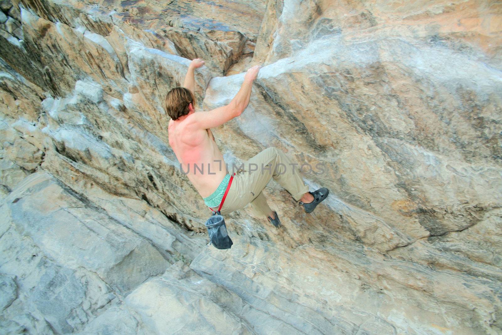 rock climber scalling a wall