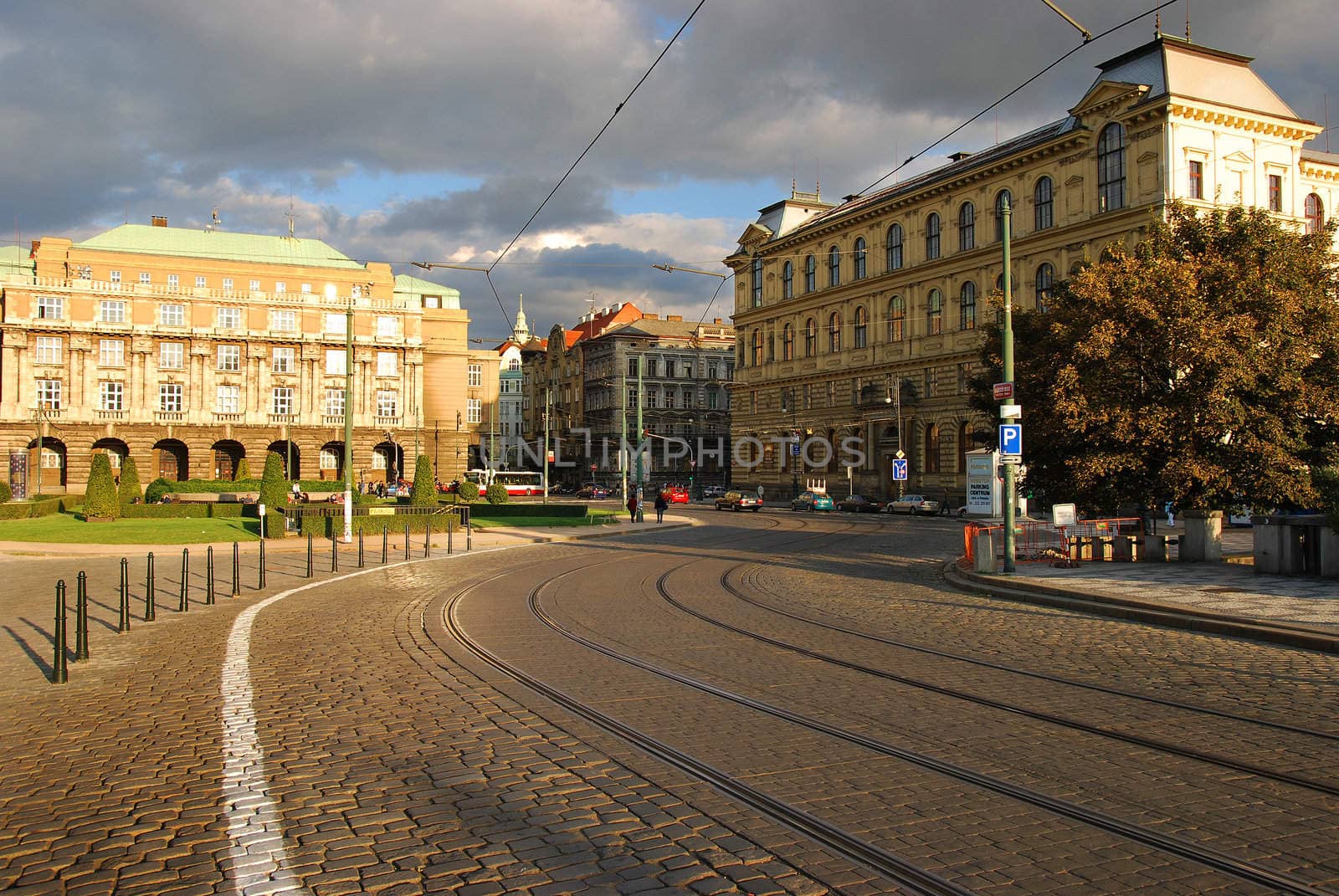 Prague street of bricks with tram lines going to brudge