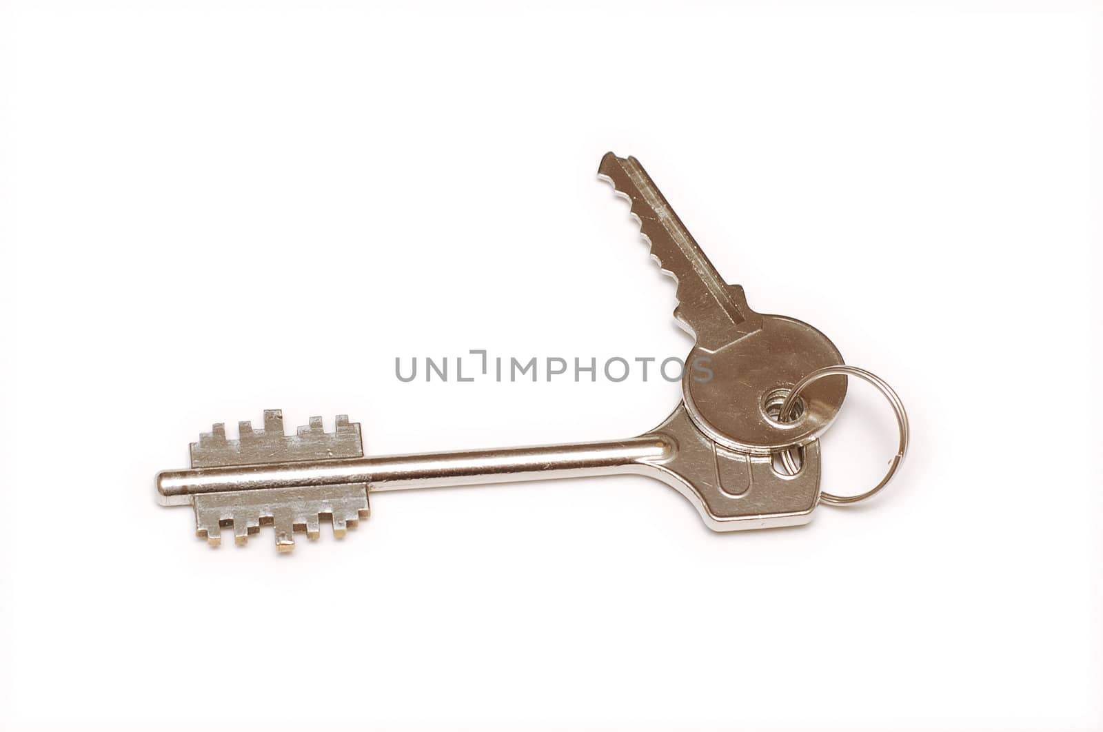 Two house door keys isolated on white background