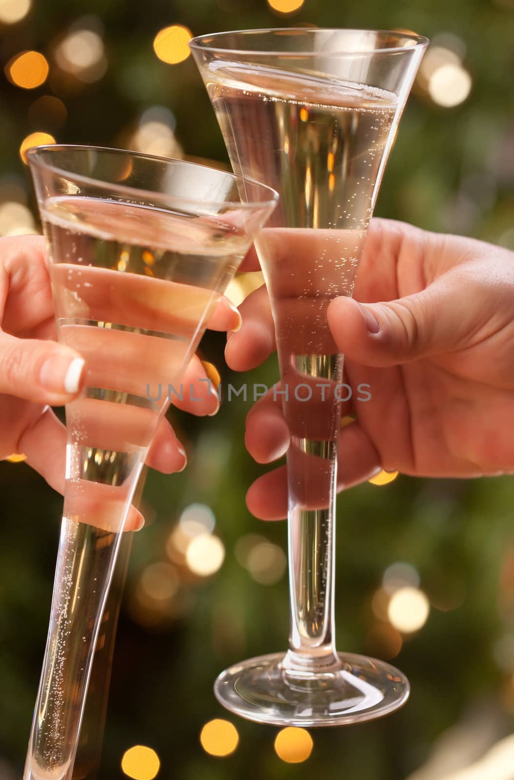 Man and Woman Toasting Champagne in Front of Decor and Lights.