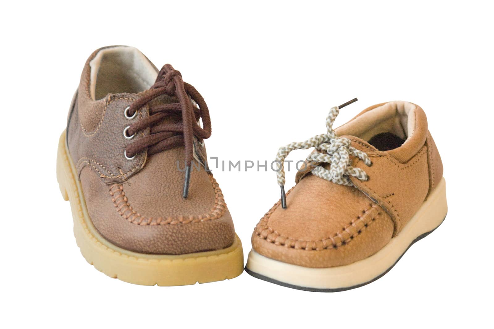Brown leather child's shoe, isolated on a white background.