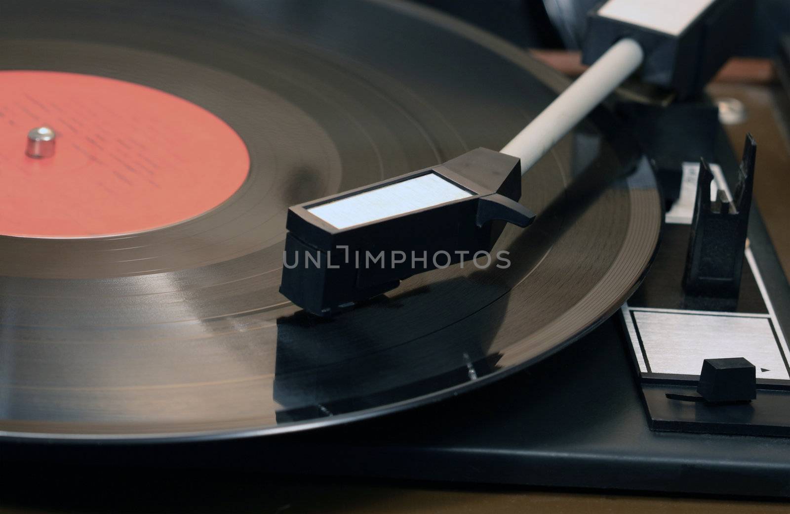 Closeup of old record player with vinyl disk