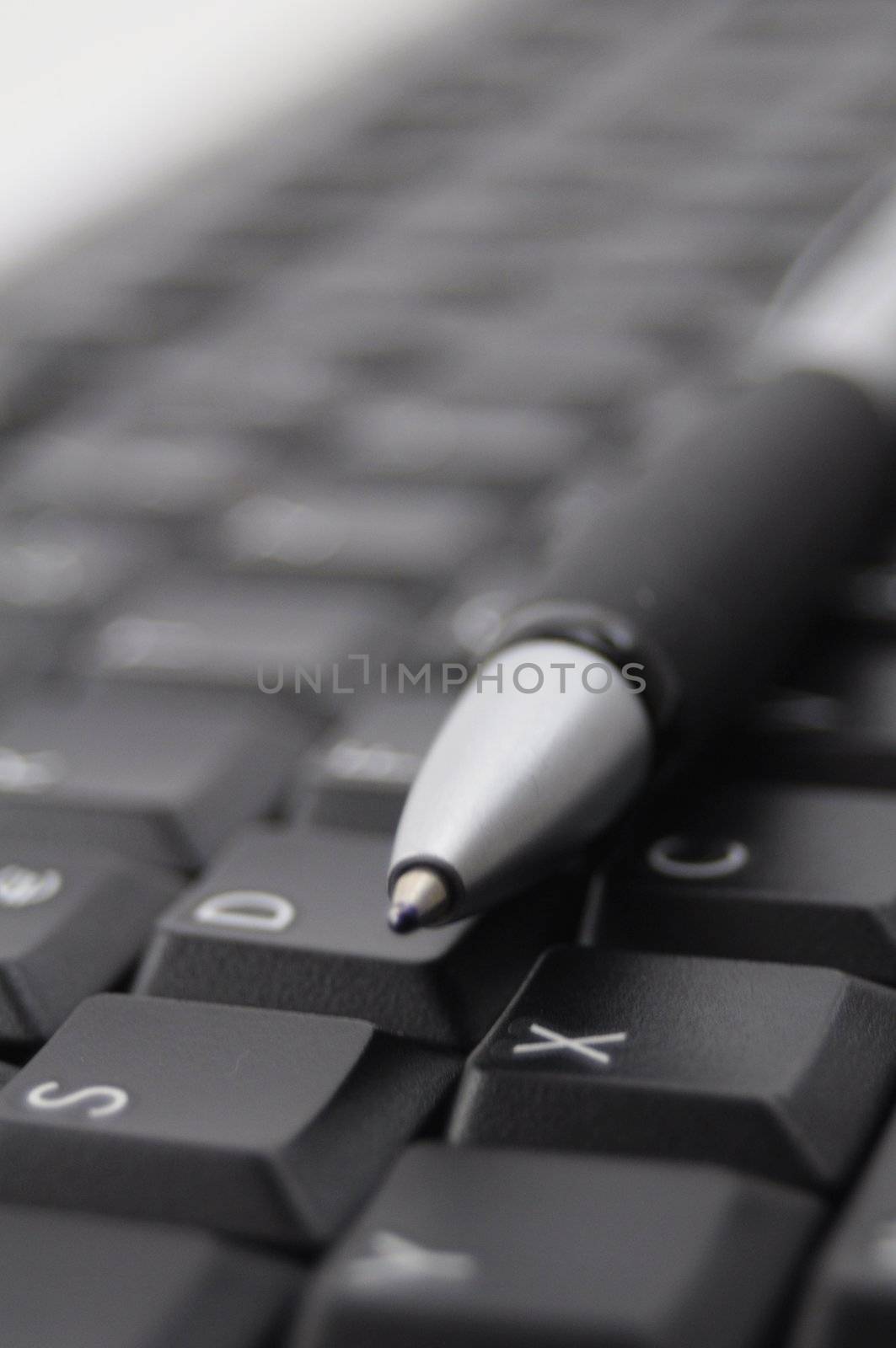 pan and black computer keyboard showing communication concept