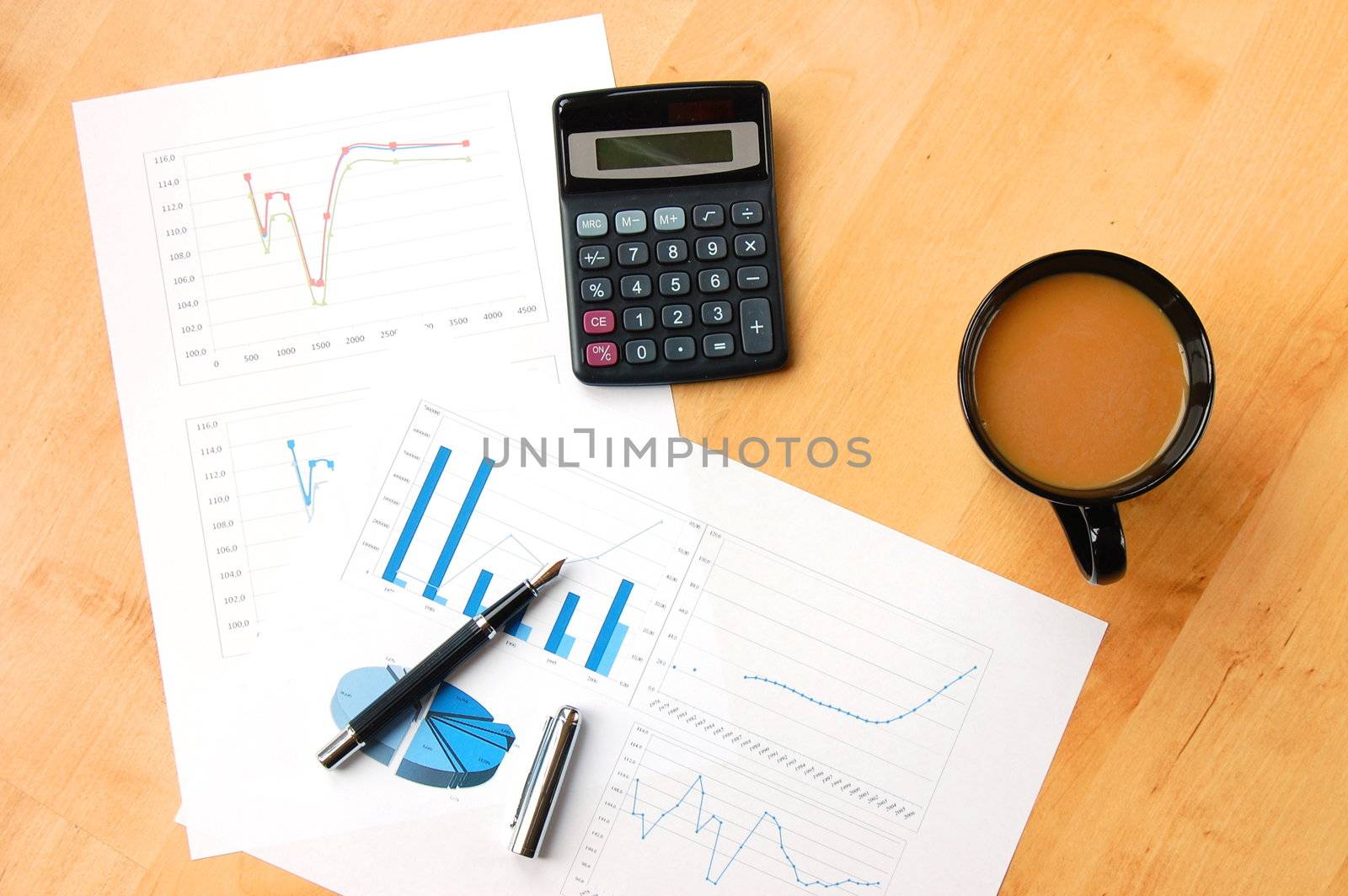 business still life with coffee and chart showing success