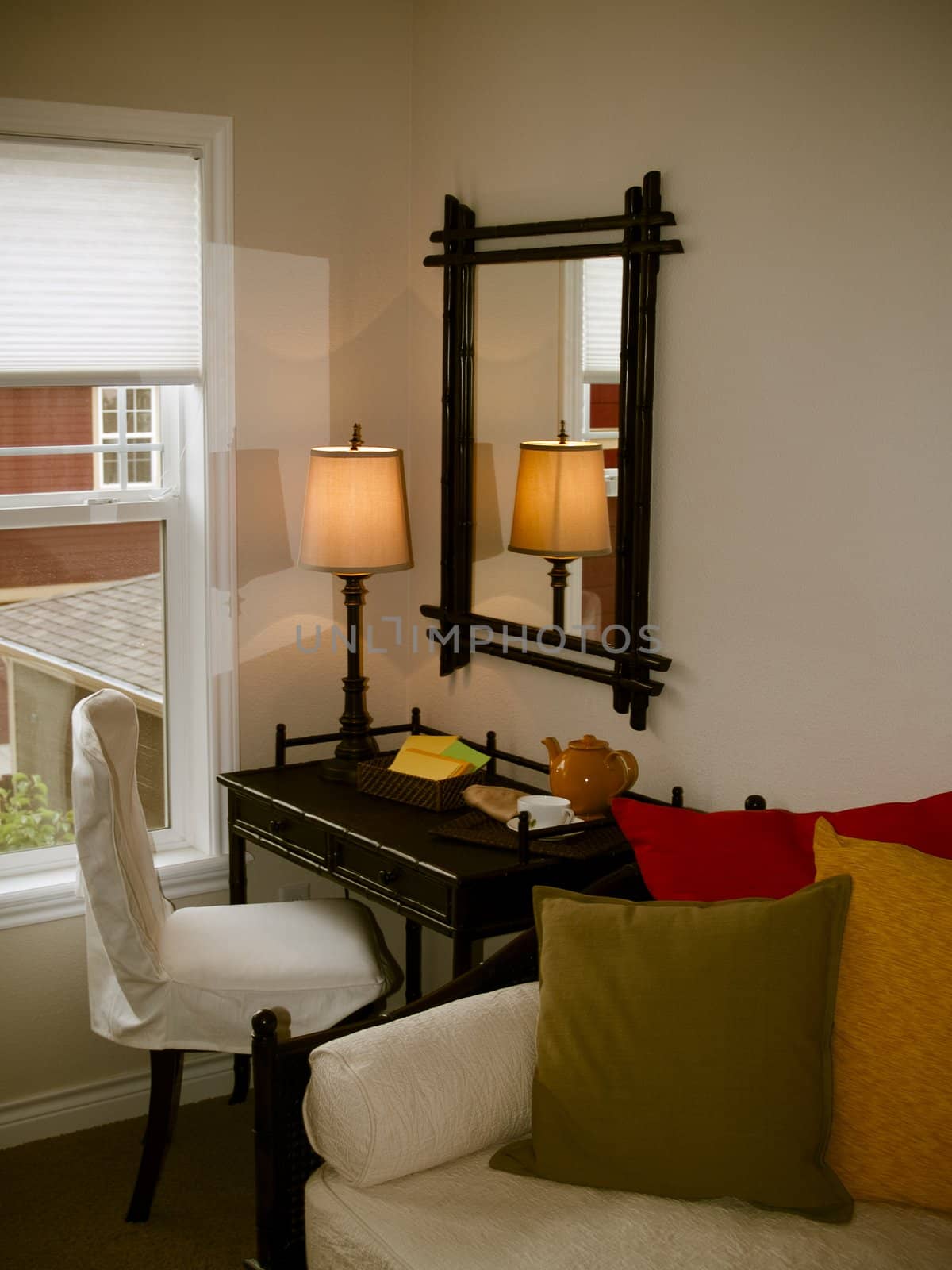 A small writing desk with mirror