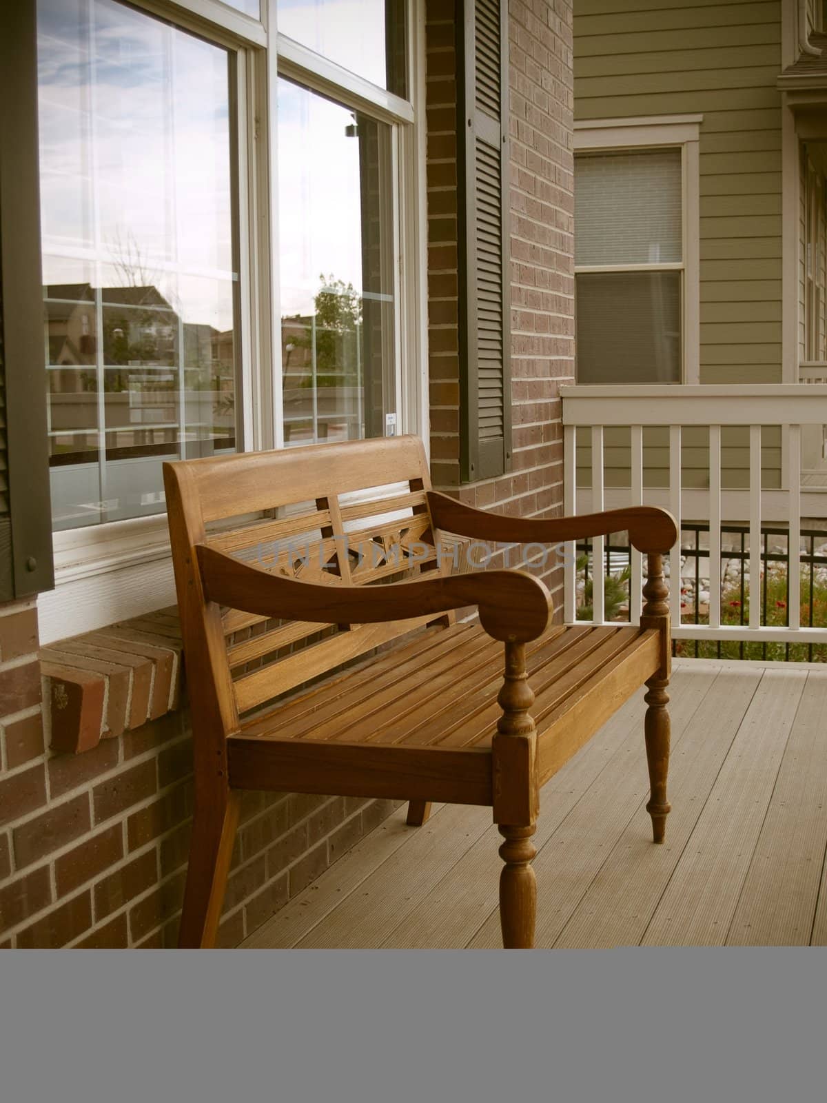 a bench sits on the front porch