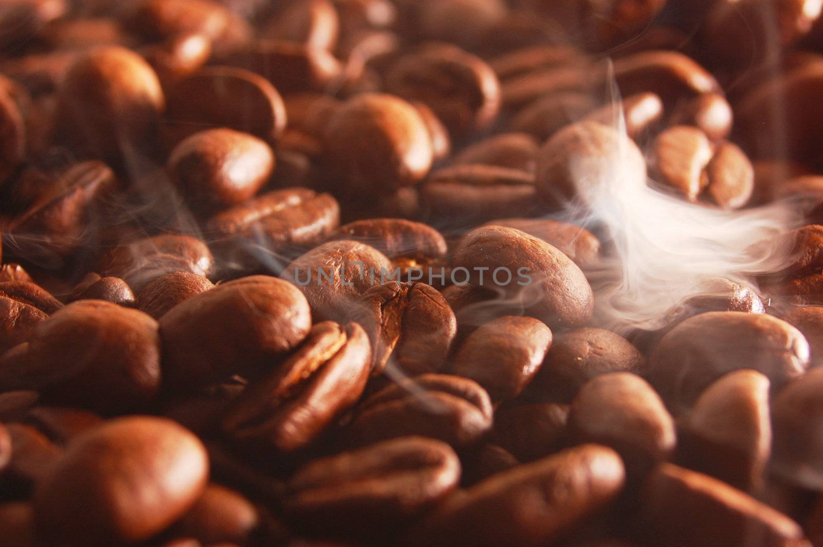 roasting coffee beans with smoke and steam