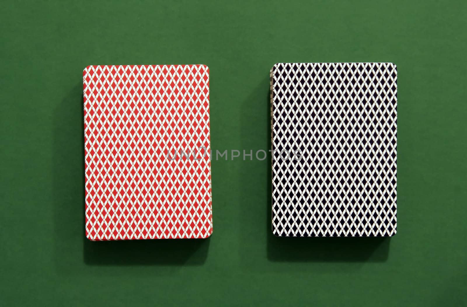 Two Decks of Cards on Green Background