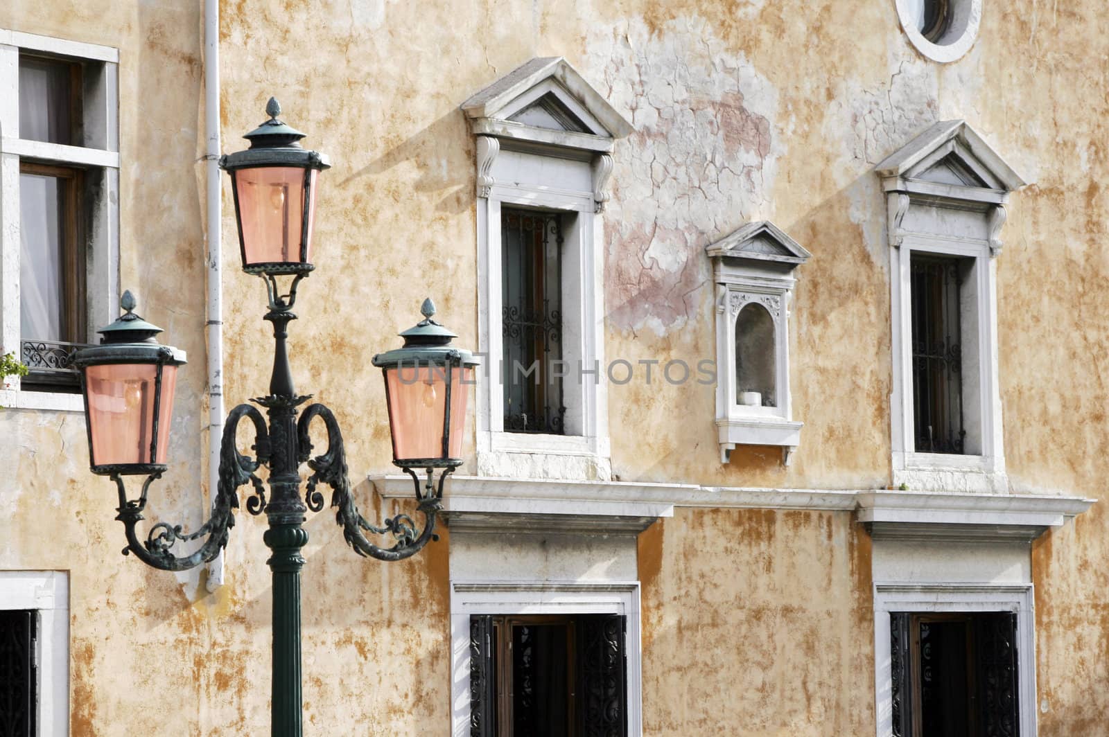 Traditional Street Light In Venice In Front Of Old Building Facade