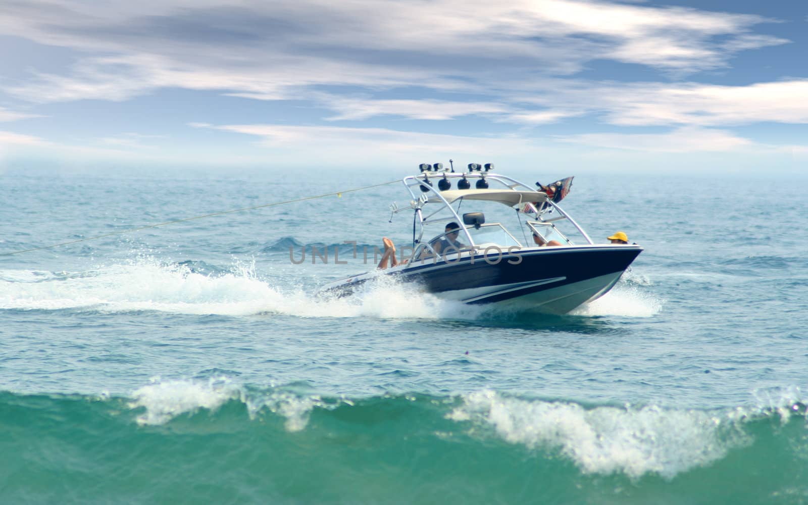 Speed boat cruising through ocean waves