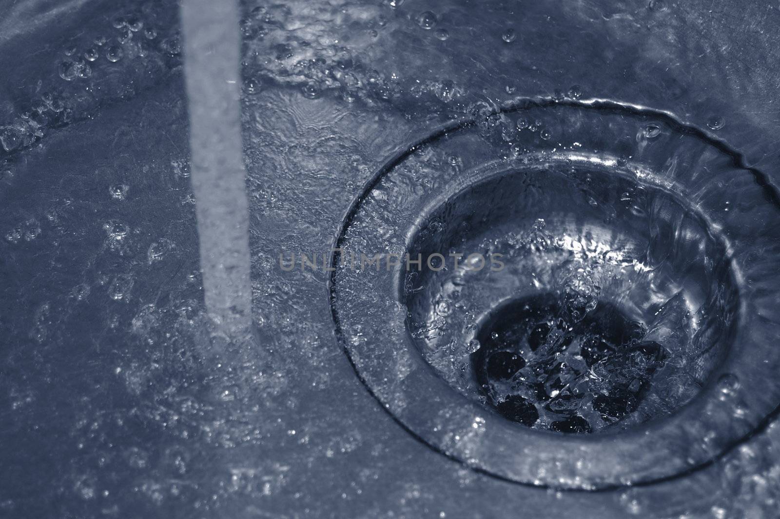 water flow into the drain in the kitchen