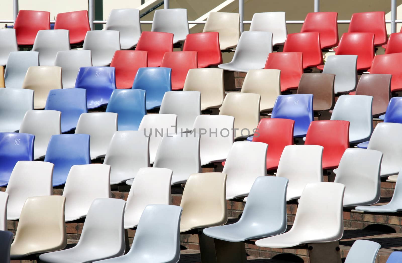 Colourful Empty Stadium Seats In Rows