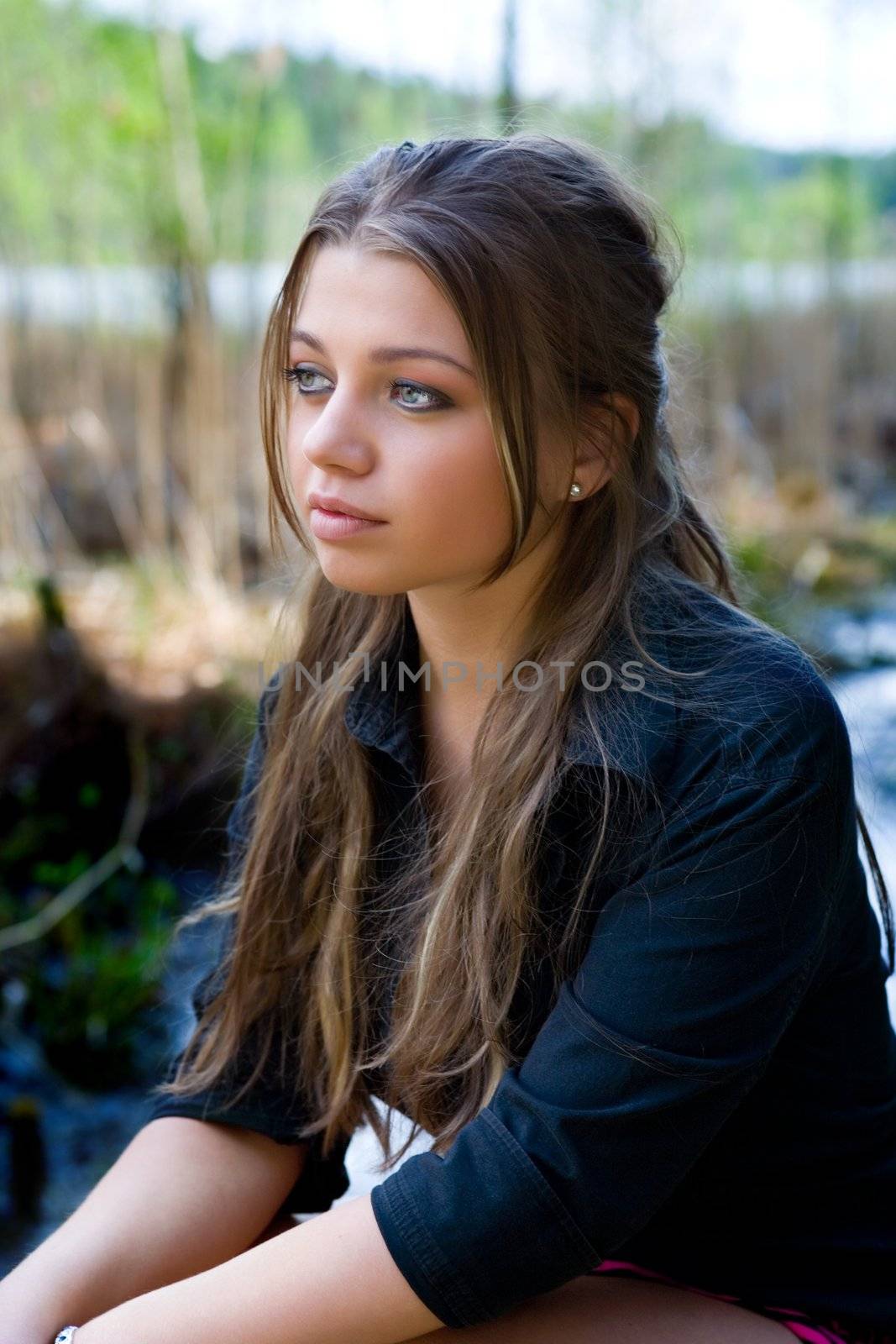 Portrait of young girl on forest background