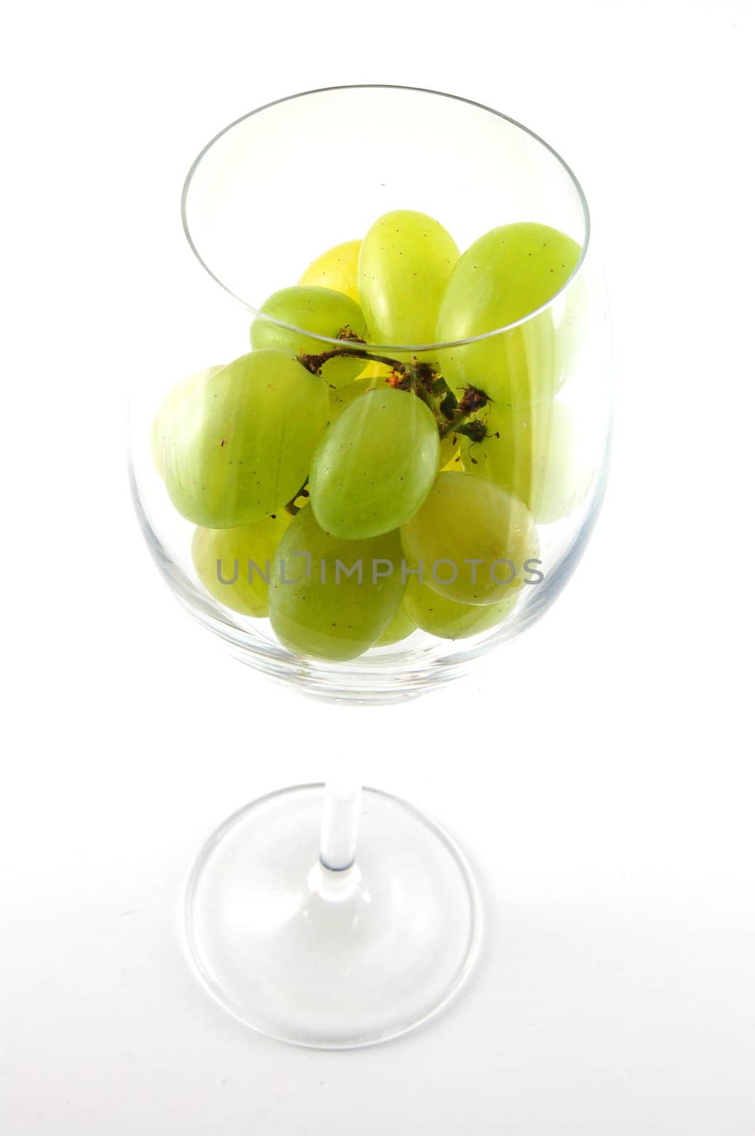 Its a grape in a glass isolated on white background.