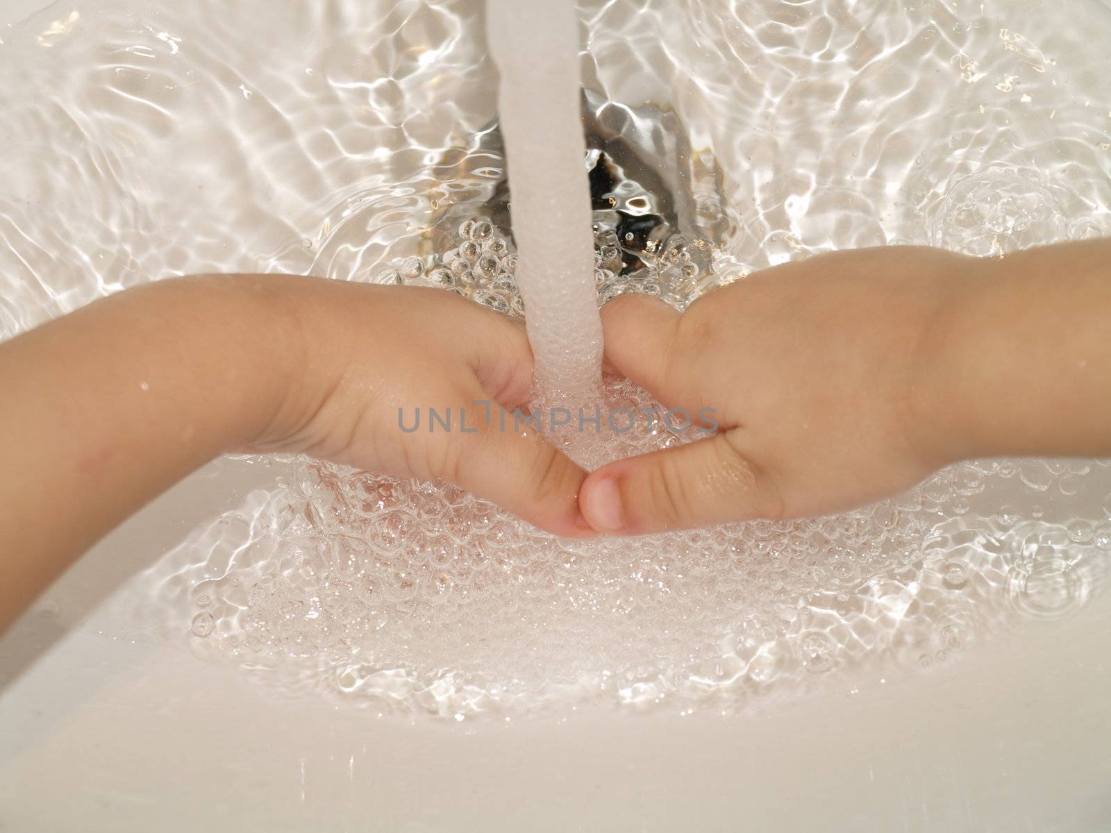 child washing hands by viviolsen