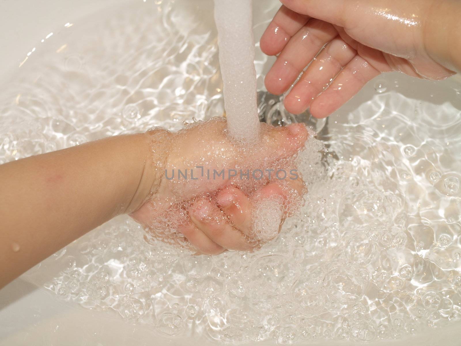 child washing hands