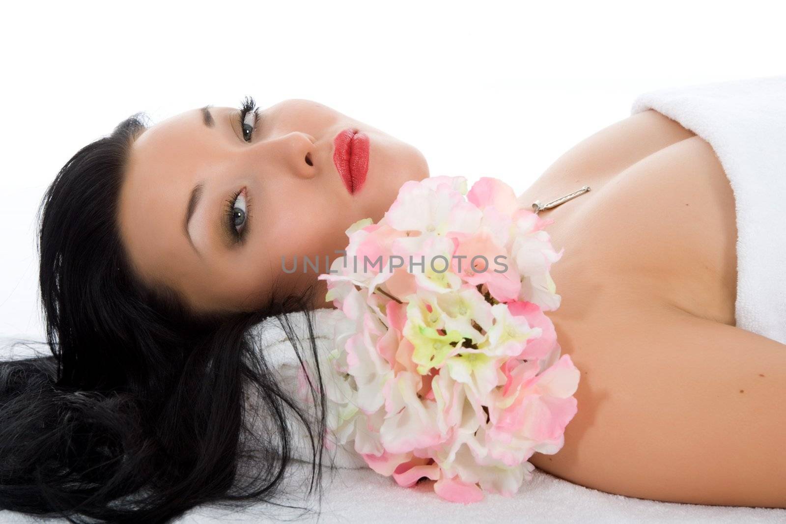 Attractive woman getting spa treatment on white