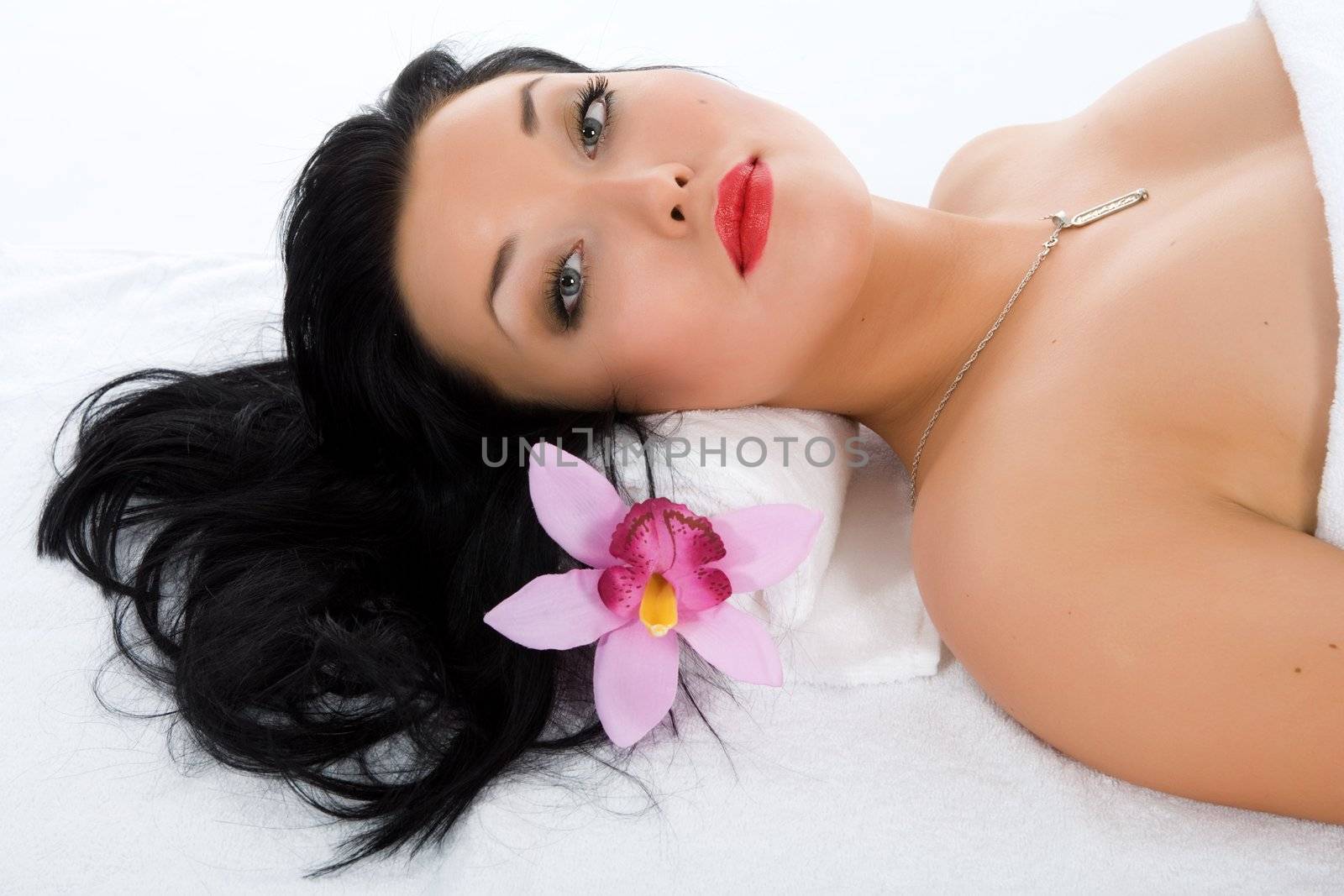 Attractive woman getting spa treatment on white