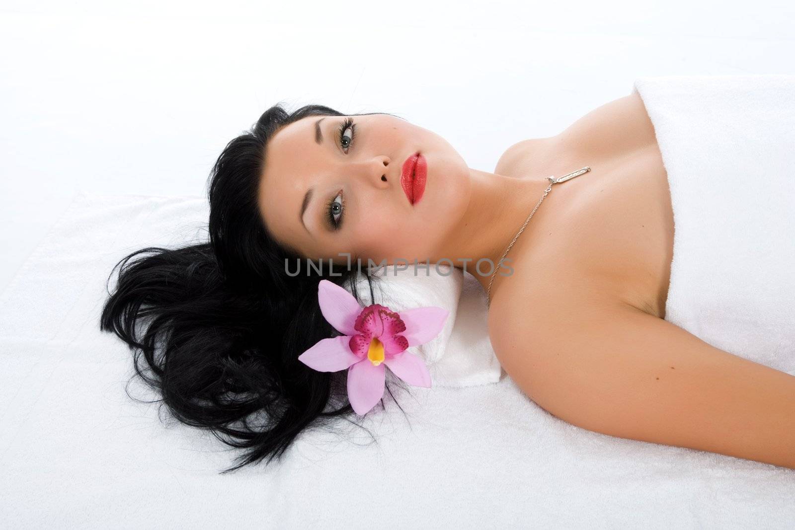 Attractive woman getting spa treatment on white