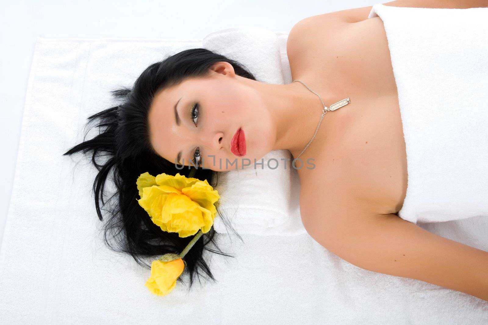Attractive woman getting spa treatment on white