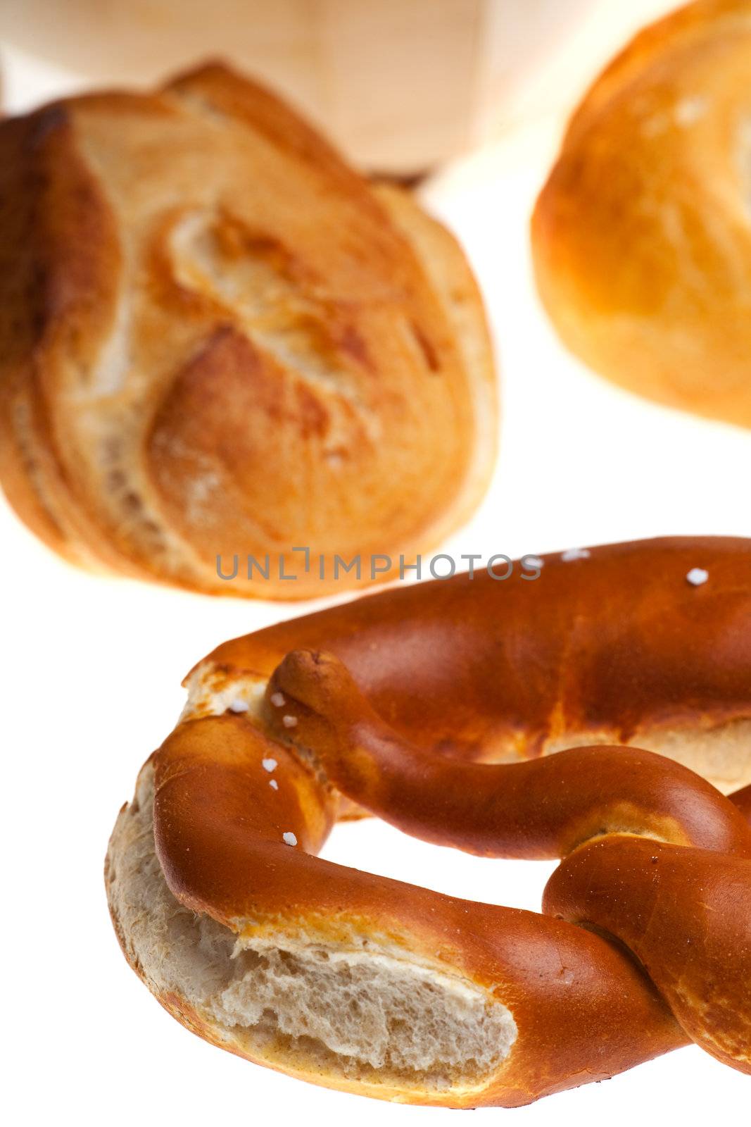 bavarian pretzel and bun isolated on white background