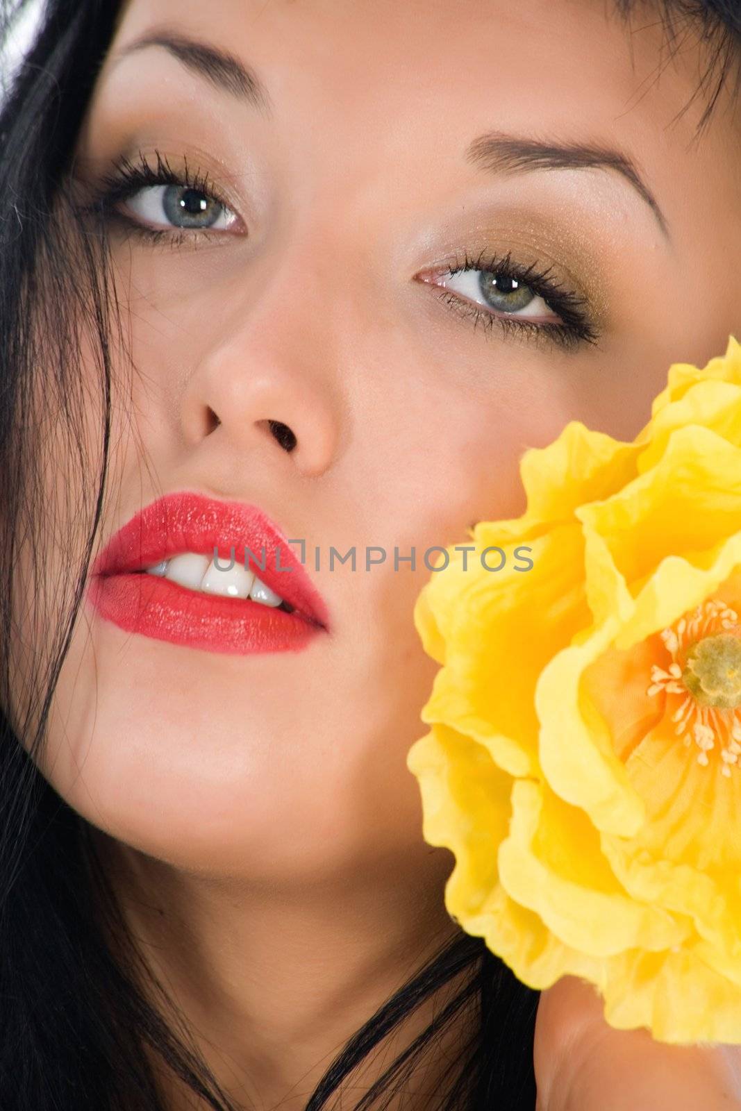 portrait of the brunette with blue eye on white background