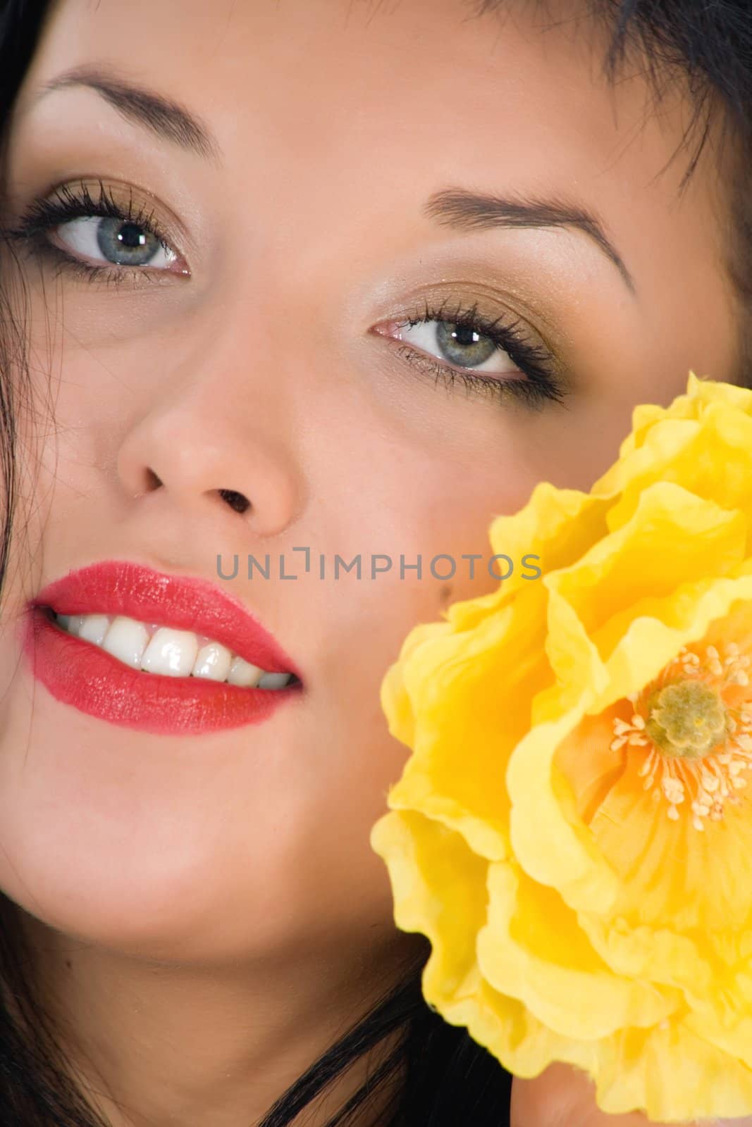 portrait of the brunette with blue eye on white background