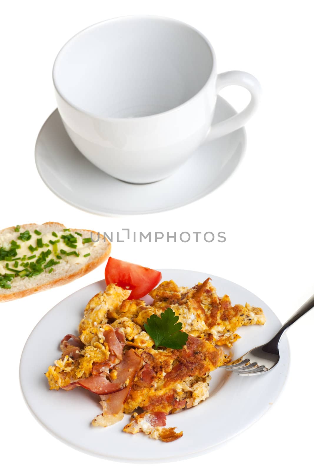 scrambled eggs and bun on a plate isolated on white