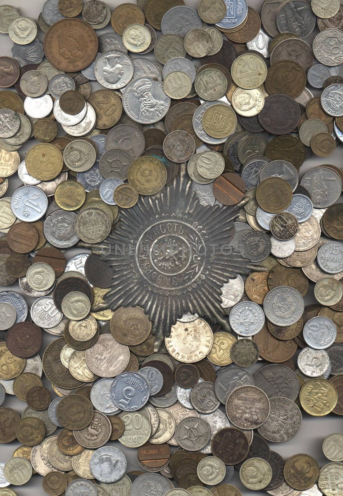 A fine texture of many different coins -silver, copper, aluminium