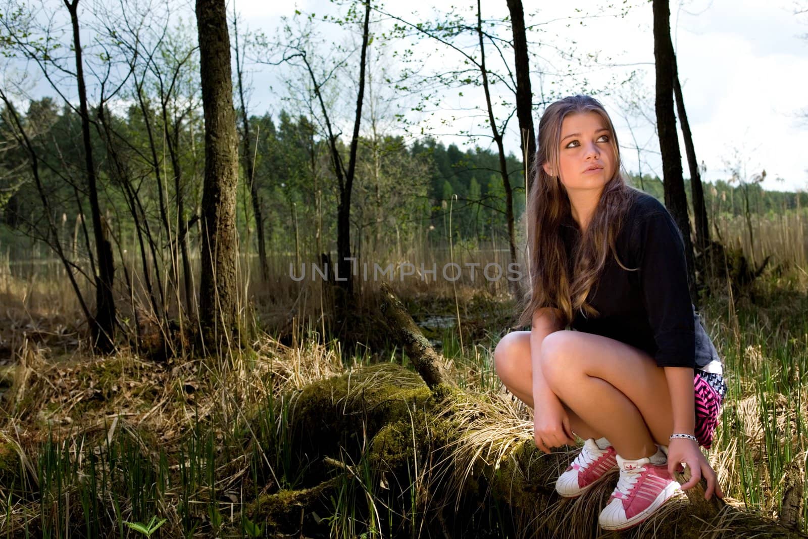 Portrait of young girl on forest background