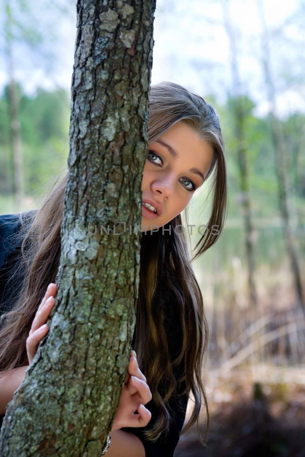 Portrait of young girl on forest background
