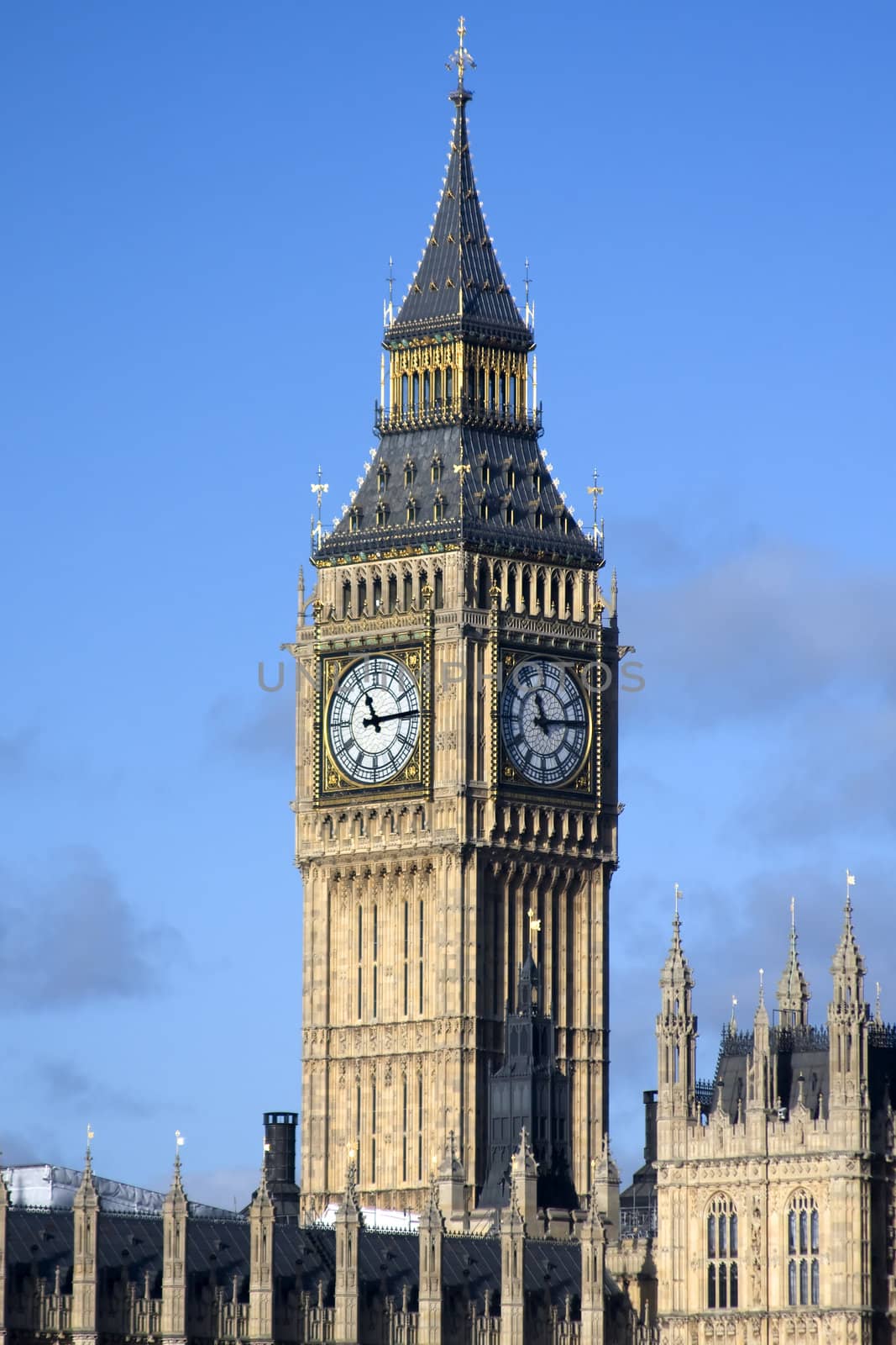 Shot of Big Ben, Westminster, London England against a blue sky
