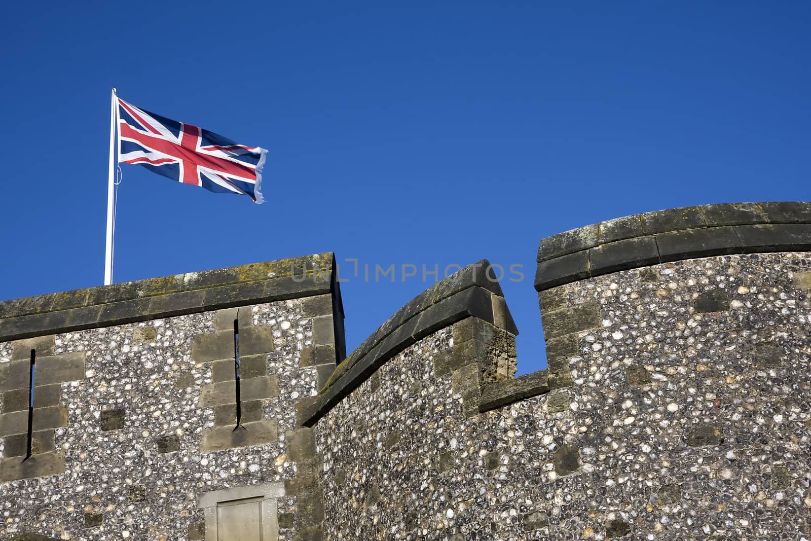 British flag flying above a castle wall