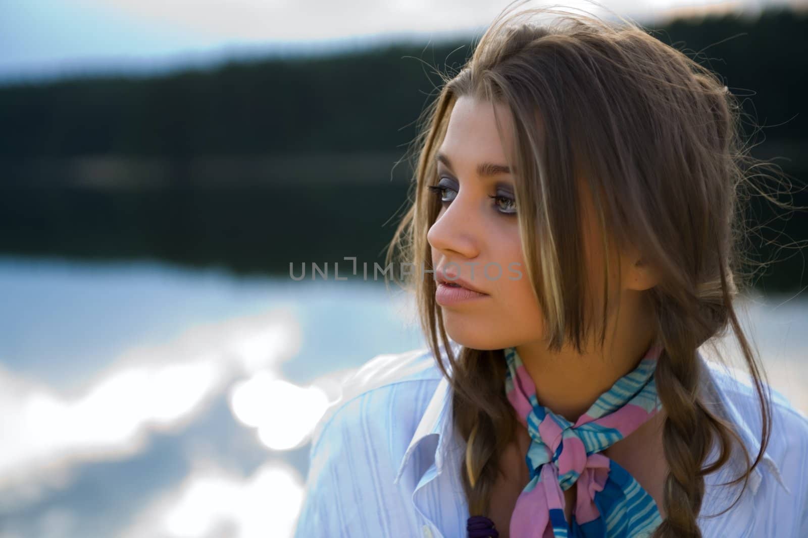 Portrait of young sexual girl on lake background