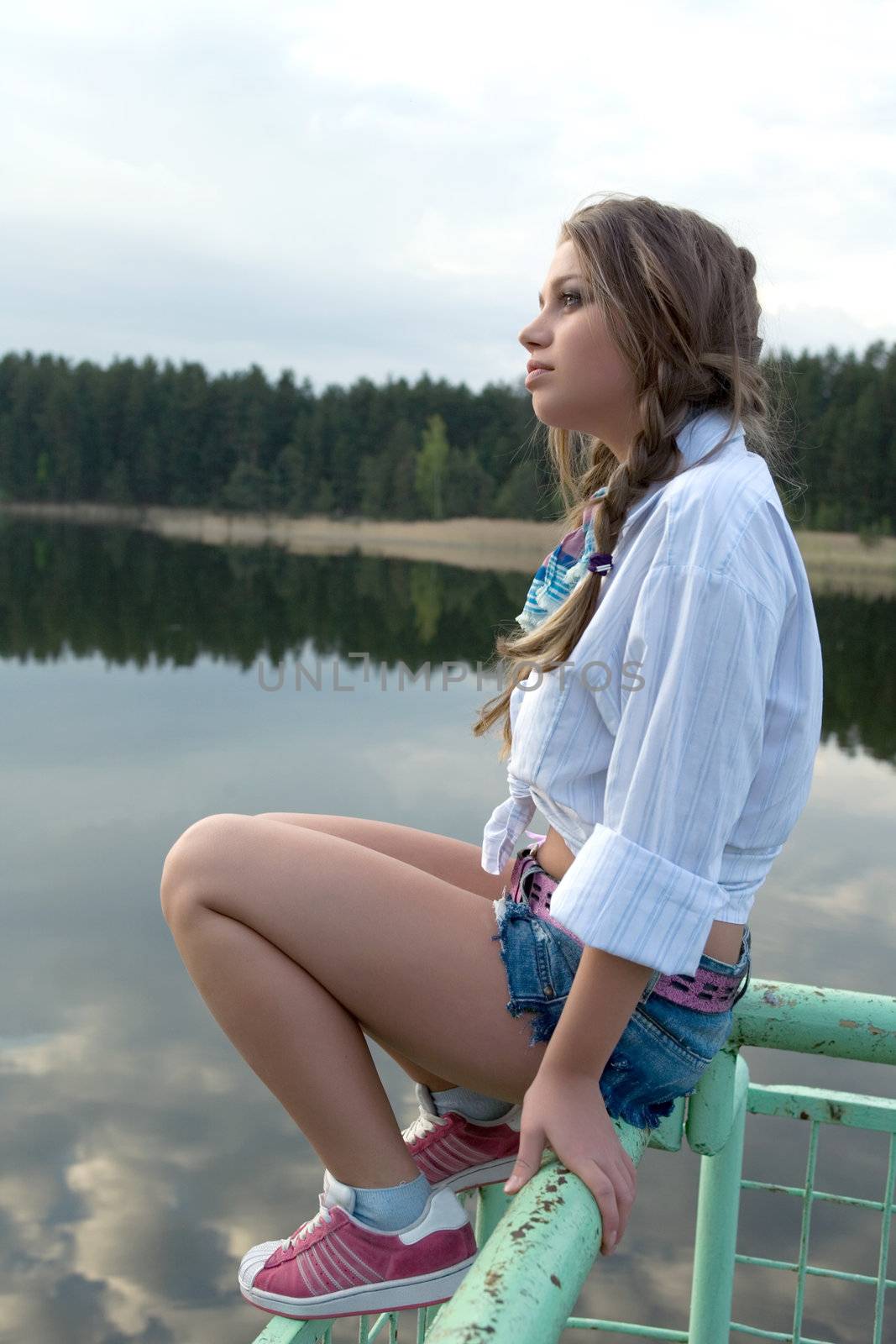  Portrait of young sexual girl on lake background