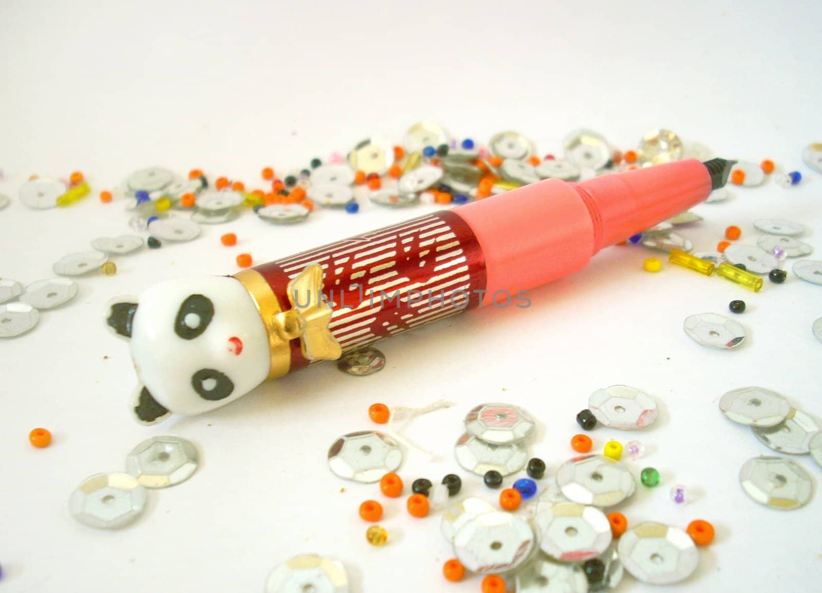 Toy pen and shining beads