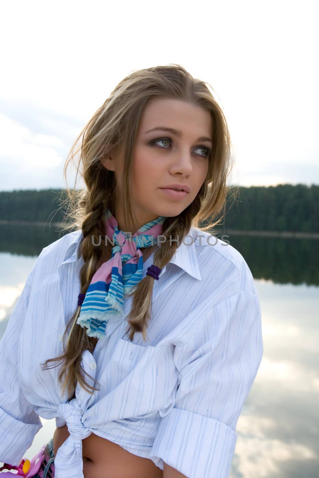 Portrait of young sexual girl on lake background
