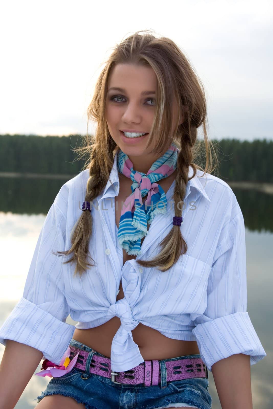 Portrait of young sexual girl on lake background