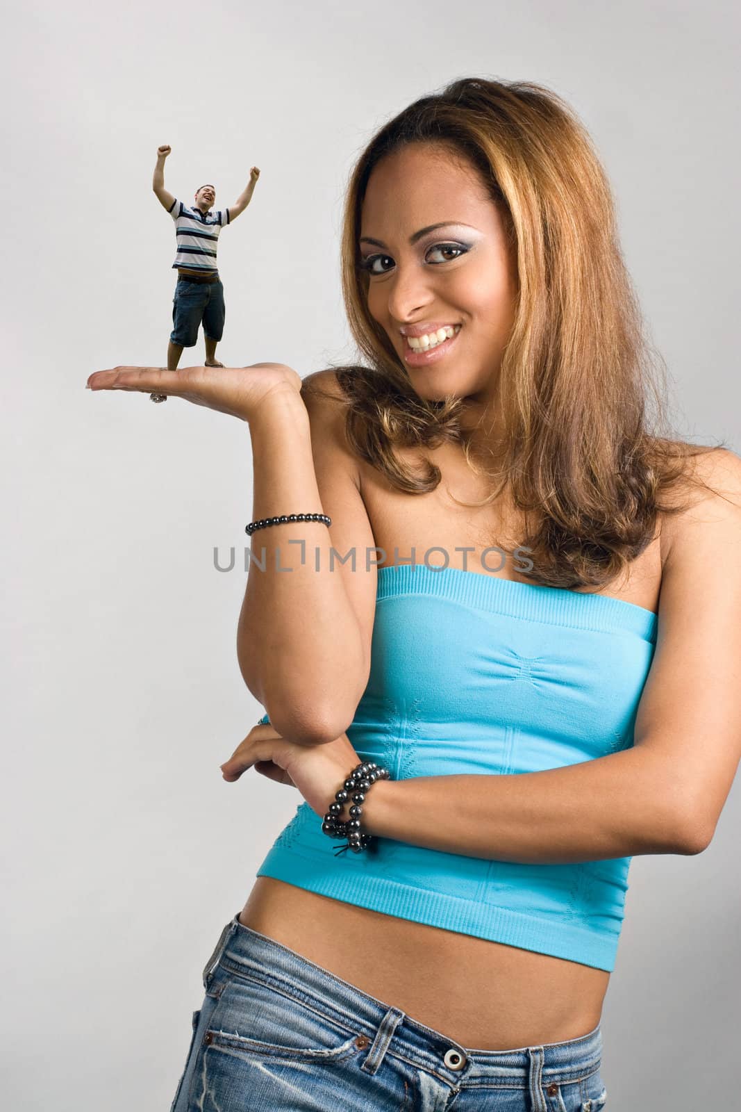 Girl Holding a Mini Man by graficallyminded