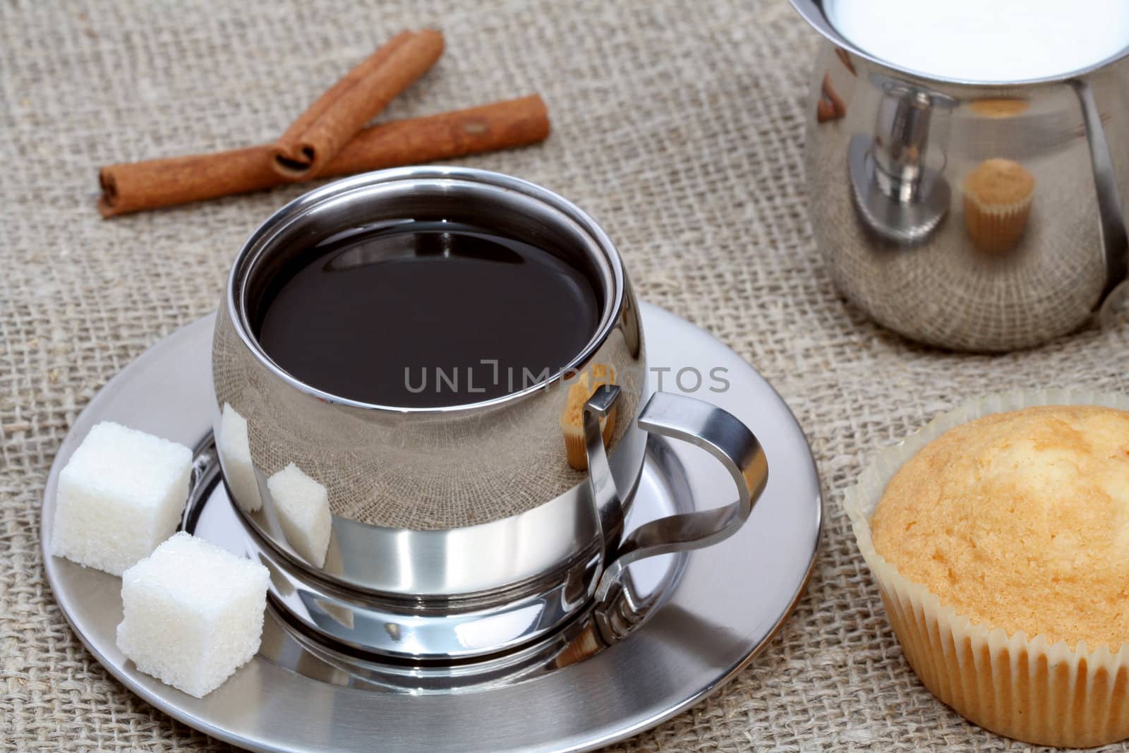 Cup of black coffee with muffin, milk and cinnamon, coffee series