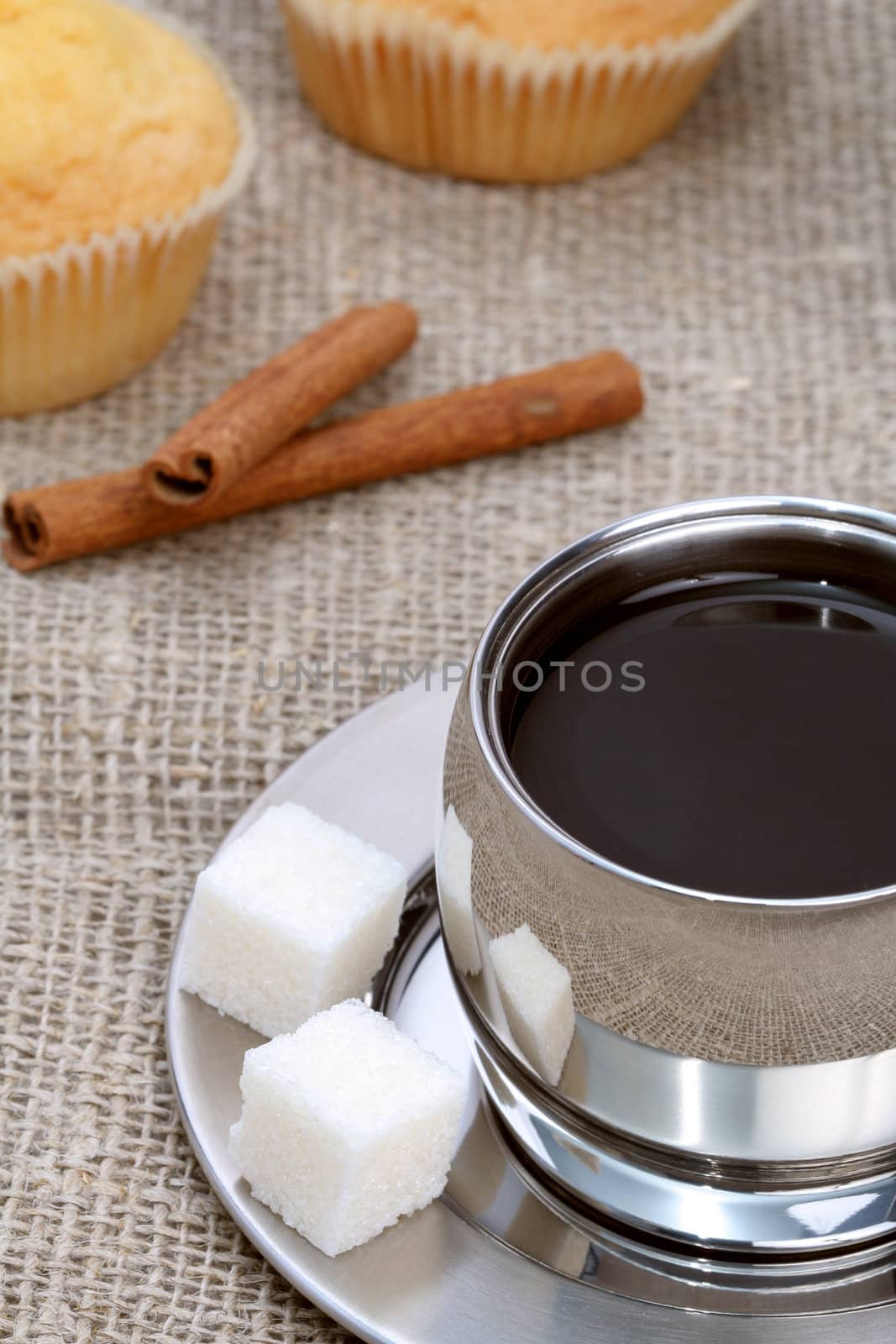 Cup of black coffee with muffin and cinnamon, coffee series