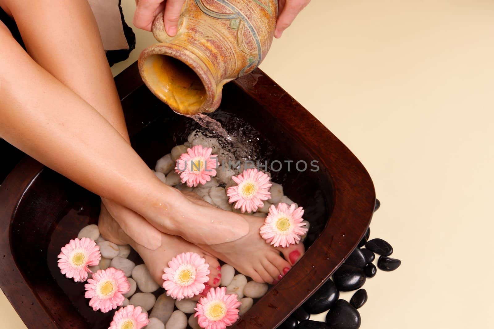 A woman enjoys a soothing foot spa pedispa