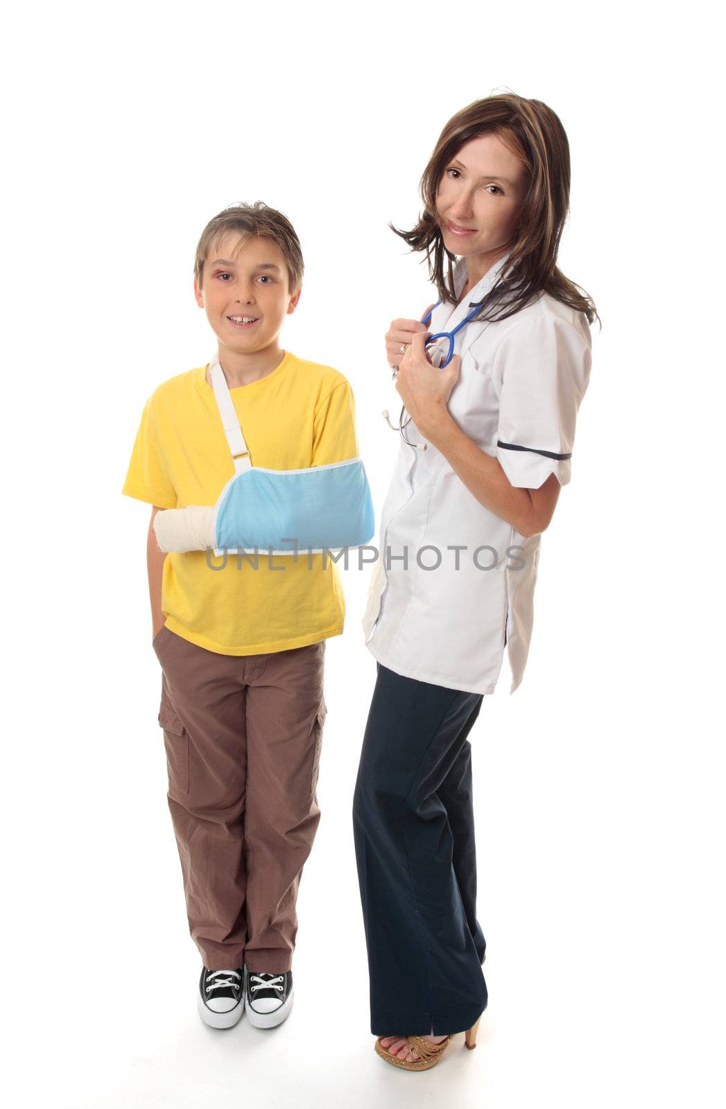 Medical officer stands beside an injured young boy.