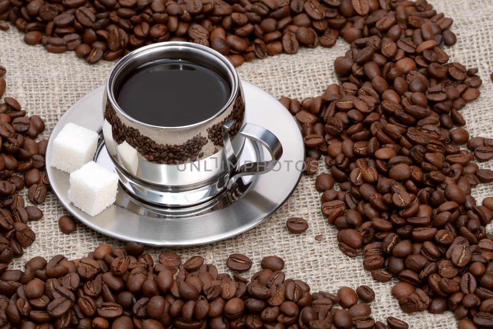 Cup of coffee with lump sugar and beans, coffee series