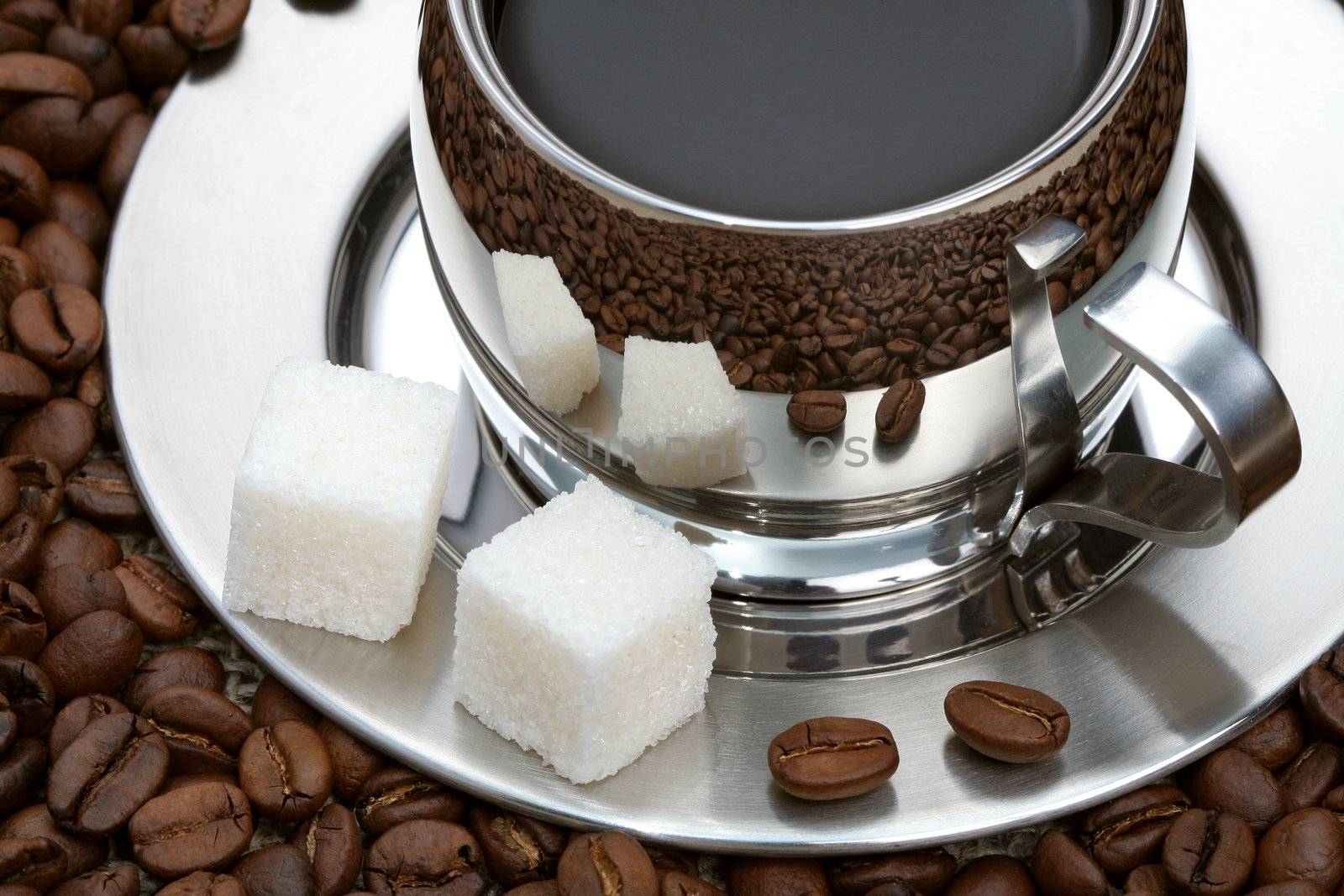 Cup of coffee with lump sugar and beans, coffee series