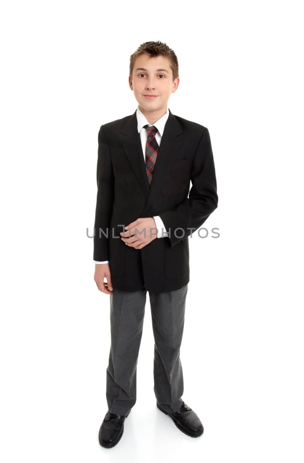 Secondary school student standing in uniform.  White background.  Shadow left under feet.