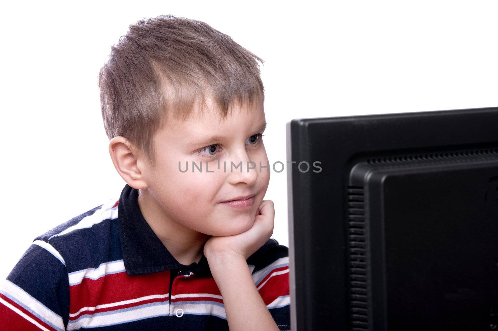 Portrait of a smiling young teenager working on computer isolated